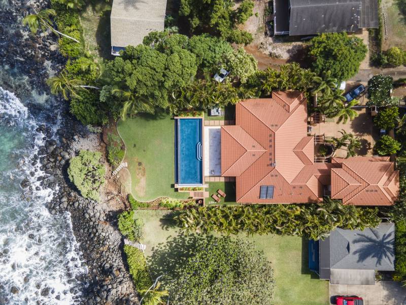 direct overhead view of maui home right on the ocean
