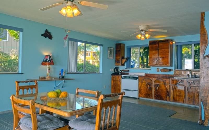kitchen and dining area with blue painted walls