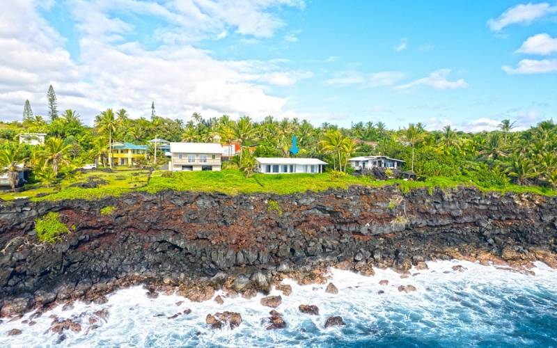 home on big island hawaii right next to black rocky beach 
