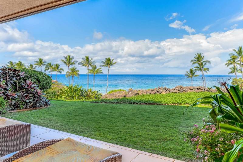 spacious lanai and grassy outdoor area with big ocean view