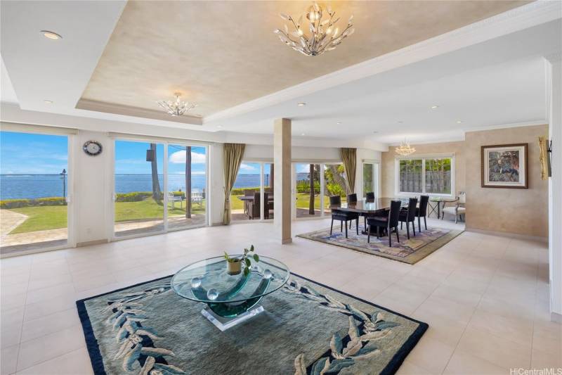 living and dining area with big sliding glass doors for ocean view