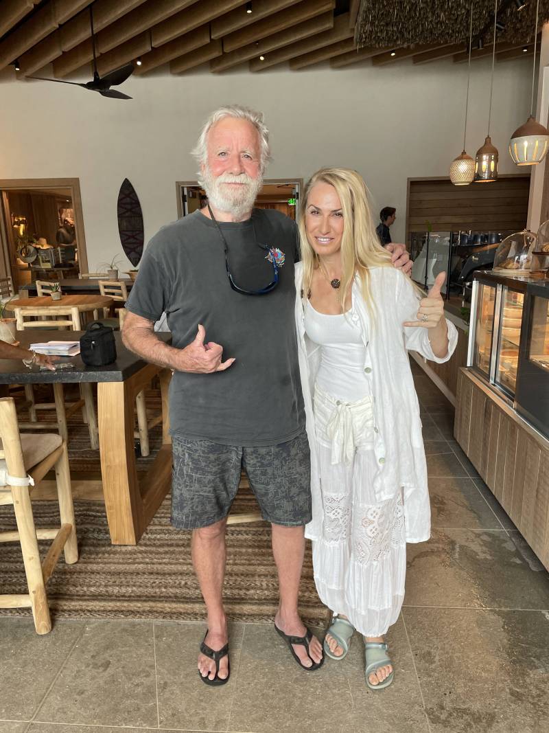 man and woman pose for photo at kauai one hotel