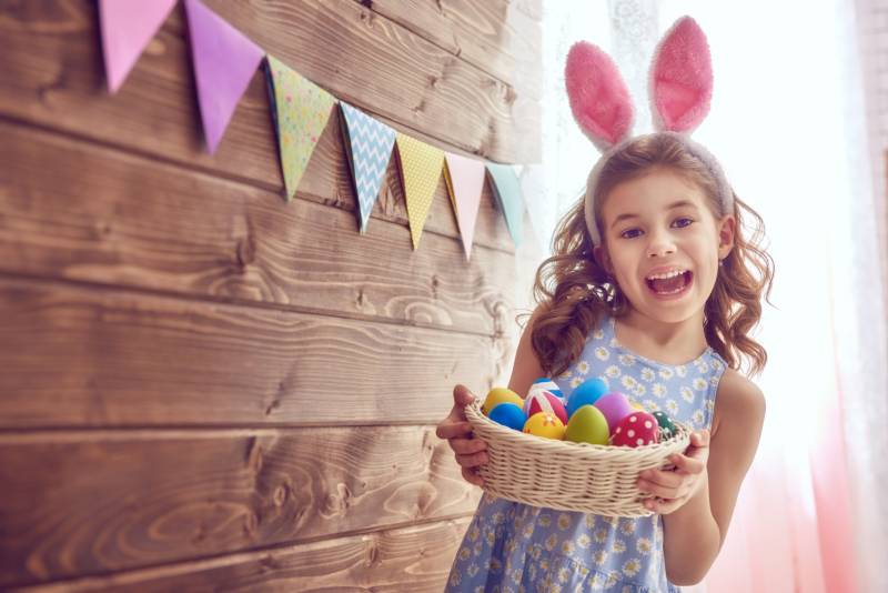 girl with basket of easter eggs
