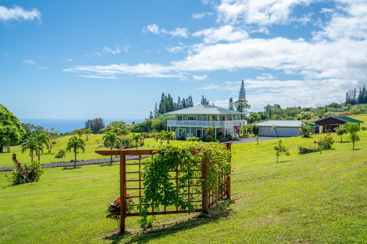 two story big island home on large grassy lot
