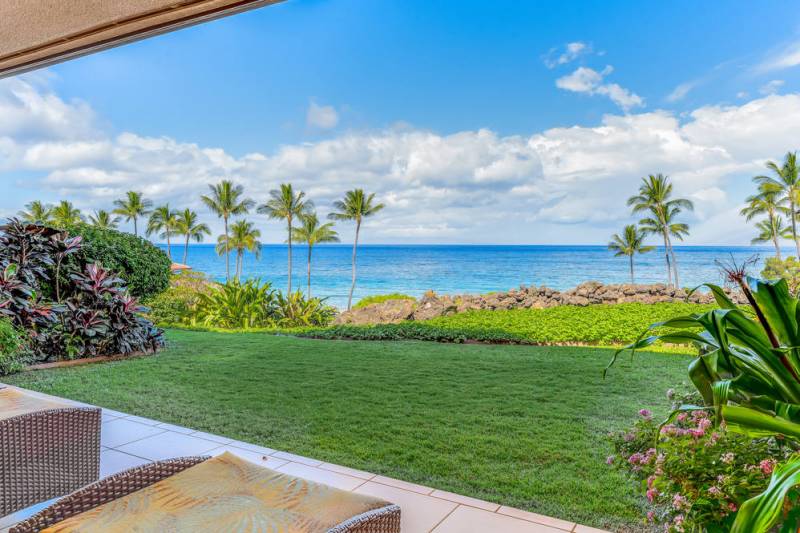 chairs under covered lanai at oceanfront hawaii home