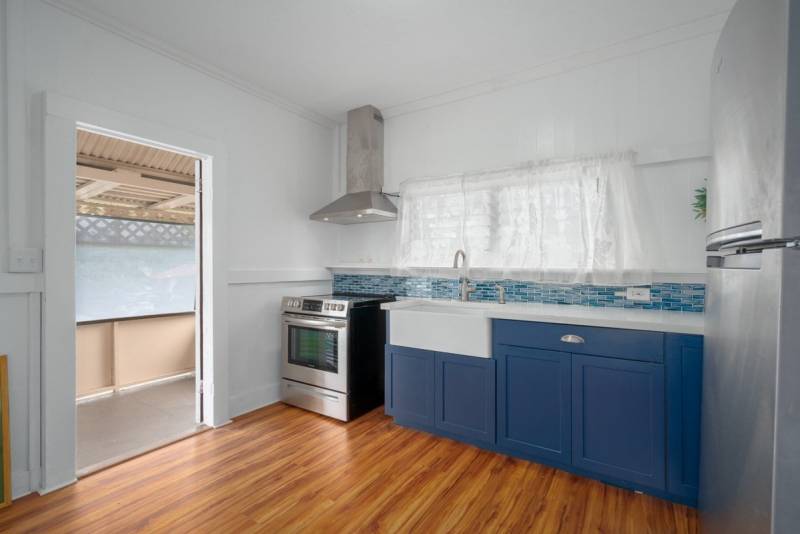 compact kitchen with blue cabinets