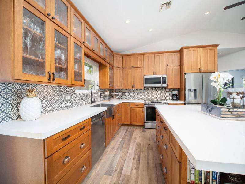 kitchen with wood cabinets and patterned tile backsplash