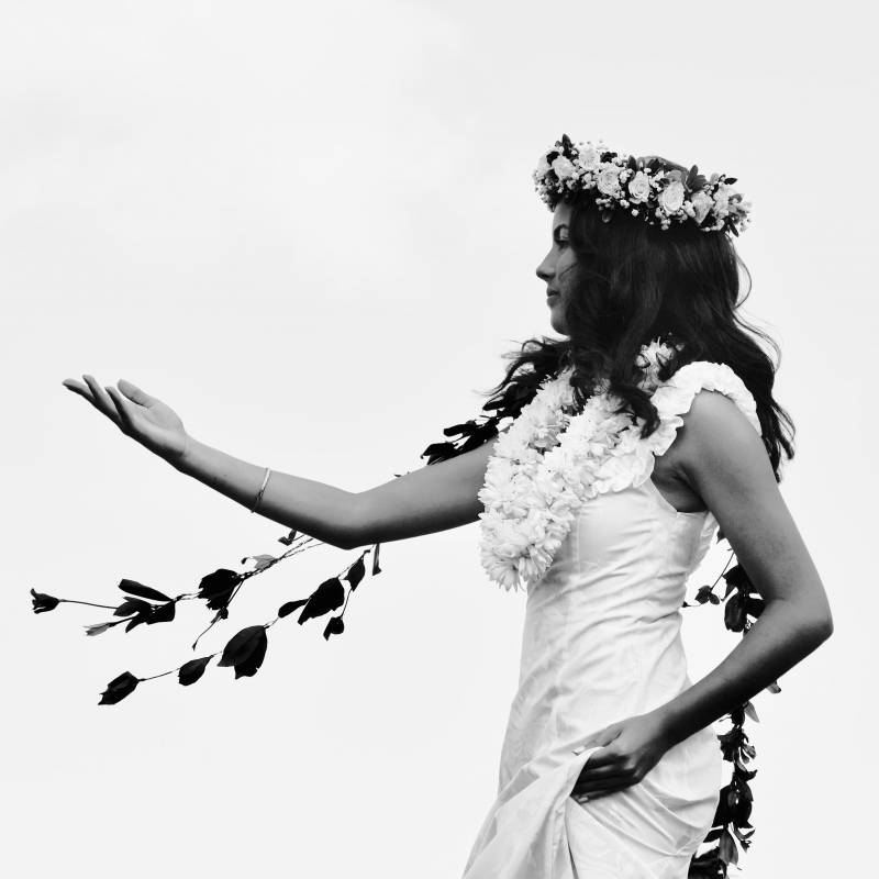 black and white photo of girl dancing hula