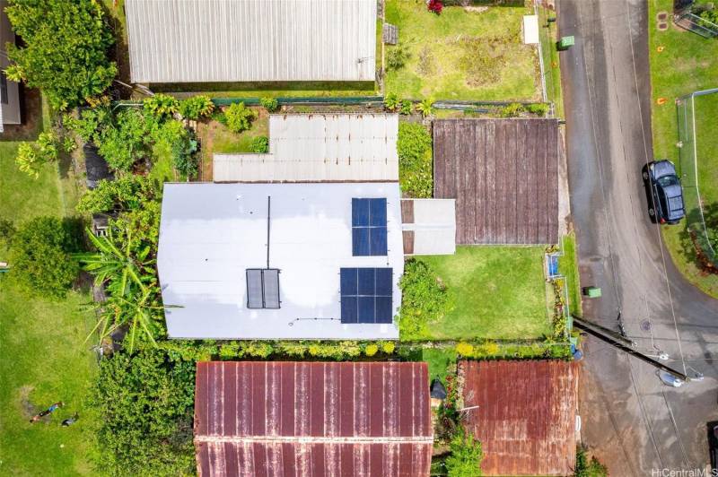 aerial view directly abover oahu home with solar panels