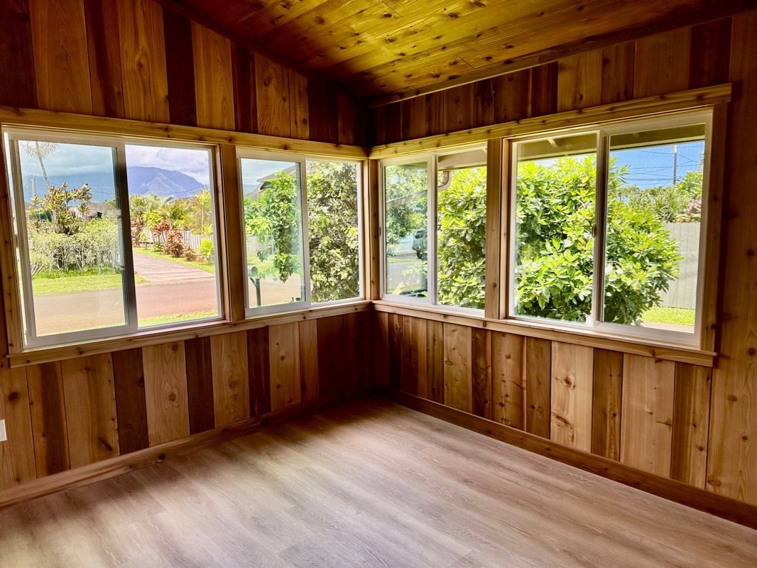 Home on the North Shore of Kaua'i With Distant Mountain and Waterfall