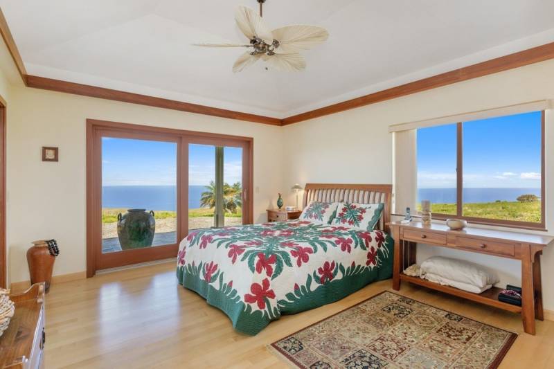 bedroom with island themed quilt on bed