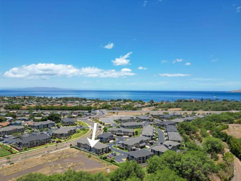 drone shot of kihei maui area with arrow pointing to condo for sale