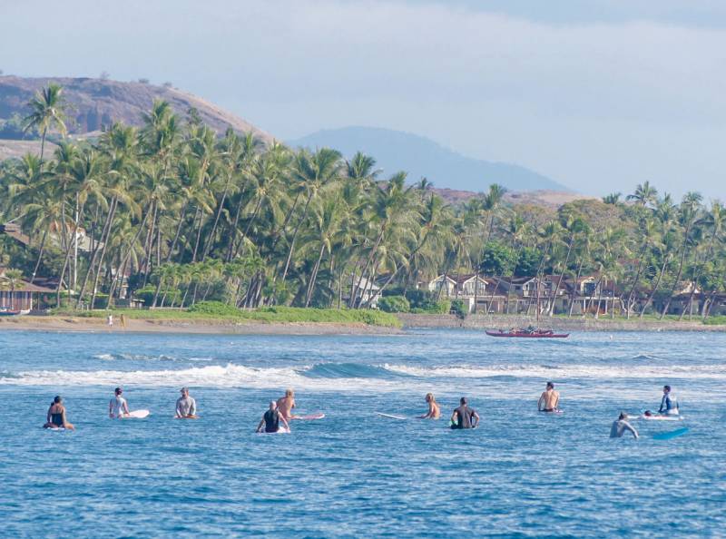 surfers out on the water near puamana maui