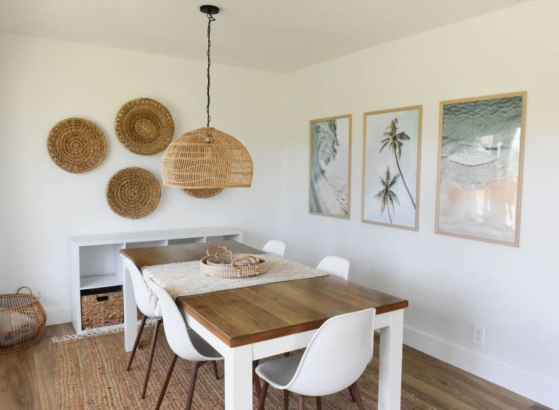 dining space with woven light hanging over table