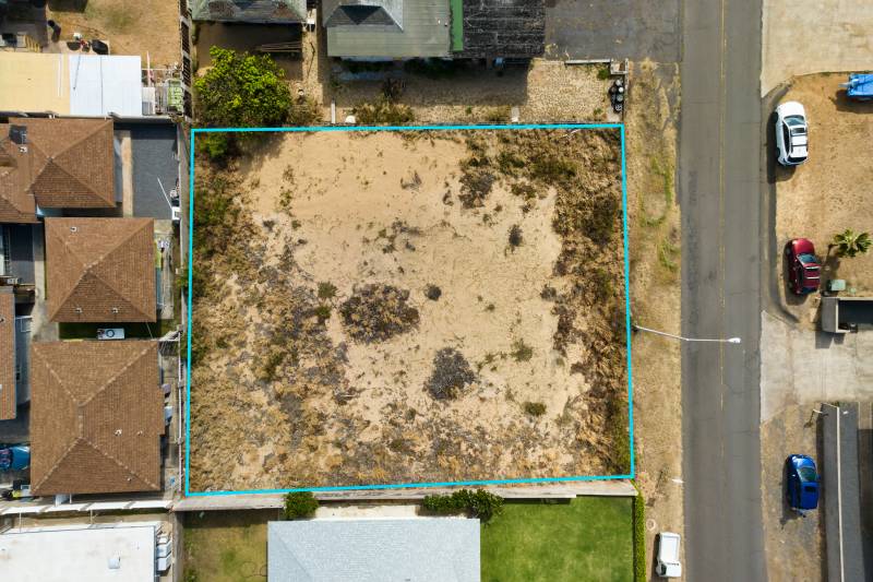 aerial view of vacant lot outlined in blue