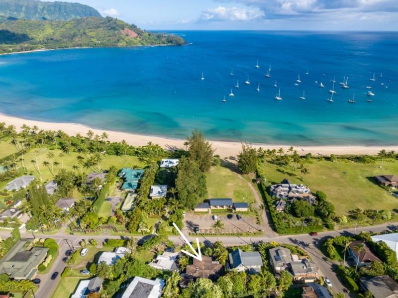 aerial view of oceanfront hanalei neighborhood with arrow pointing to home