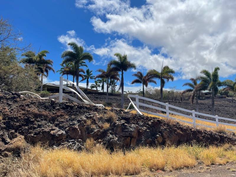 fire melted fence from brush fire near kohala ranch homes