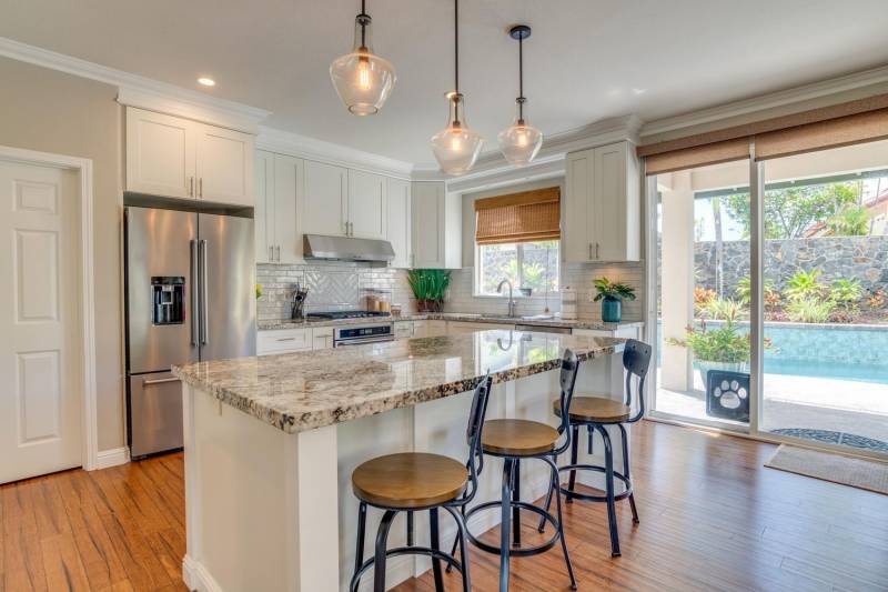 kitchen with white cabinets and granite counter tops