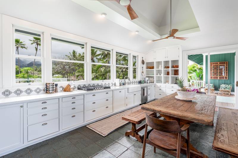lots of windows above countertops in kitchen let in beautiful oahu views