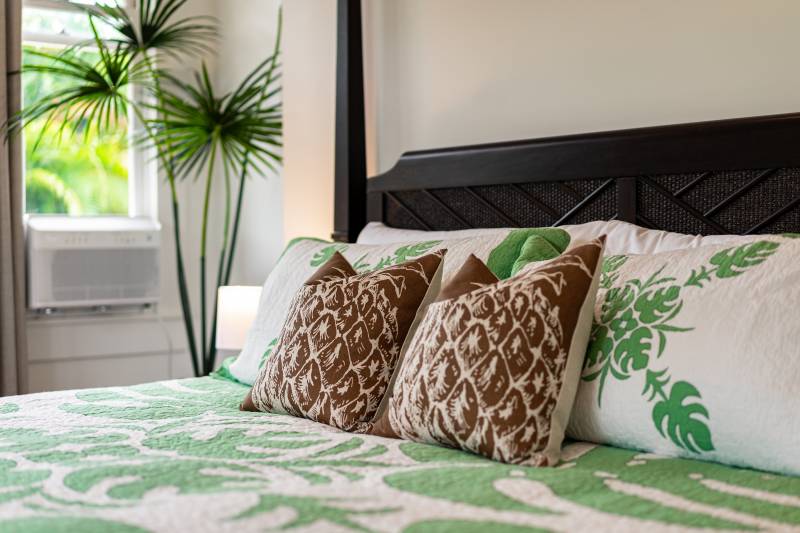 bed with tropical themed bedding