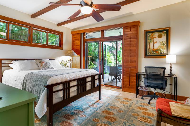 bedroom with doors leading to lanai