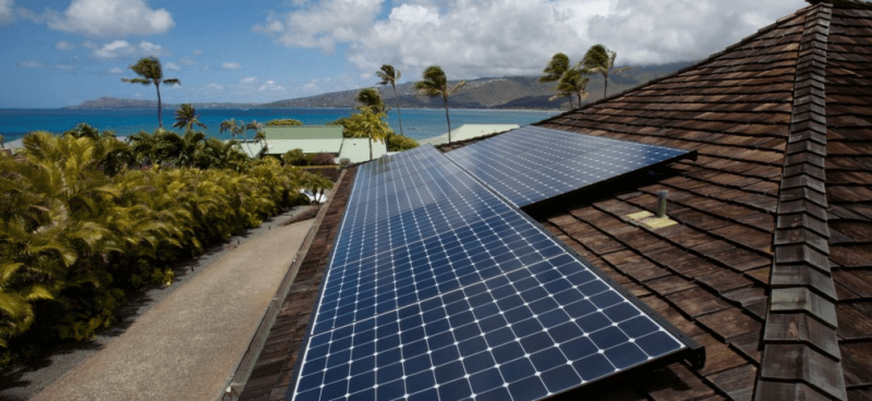solar panels on top of ocean view home in hawaii