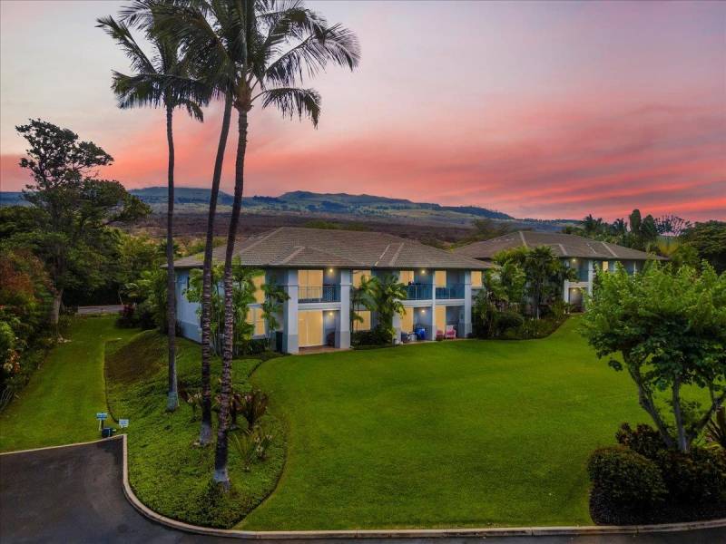 maui home and grass yard at sunset