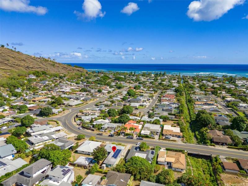 aerial view of aina haina neighborhood with red arrow pointing to house for sale