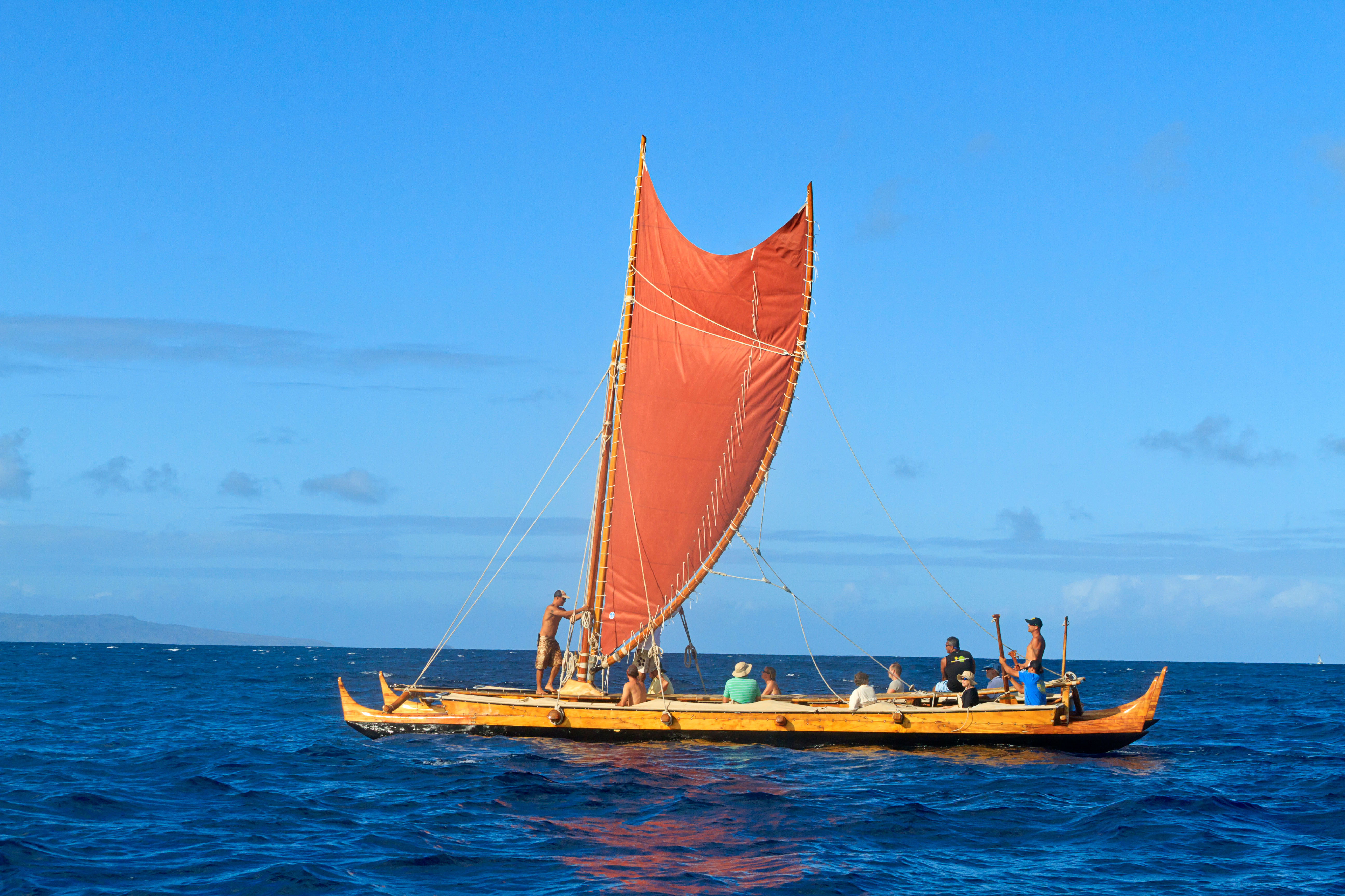 replica hawaiian war canoe on the water