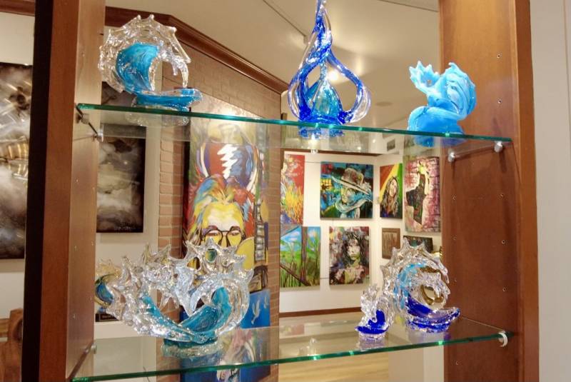 glass sculptures displayed on glass shelves