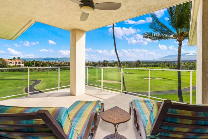 chairs on covered lanai overlooking golf course