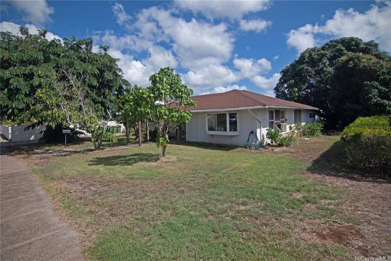 white house with red roof in kahala oahu for sale