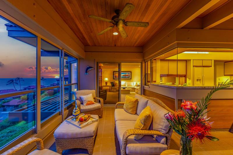 large windows in condo look out toward hawaii ocean views