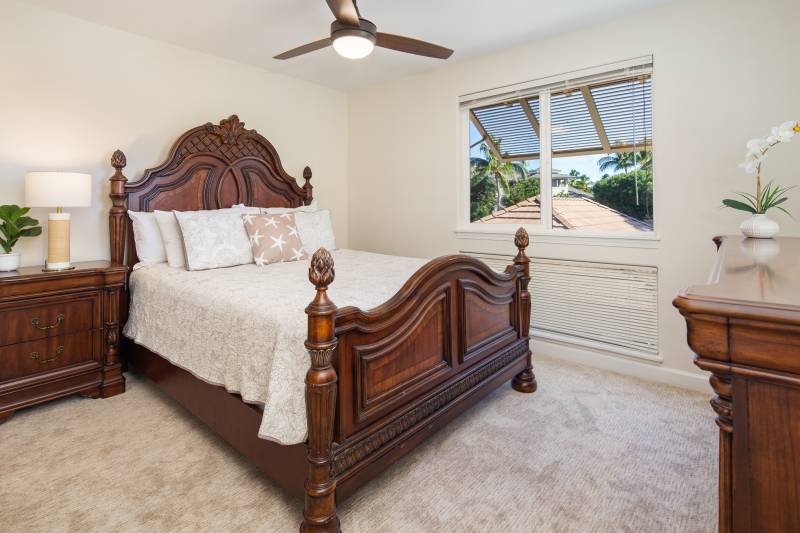 bedroom with beige carpet and dark wood bedroom set