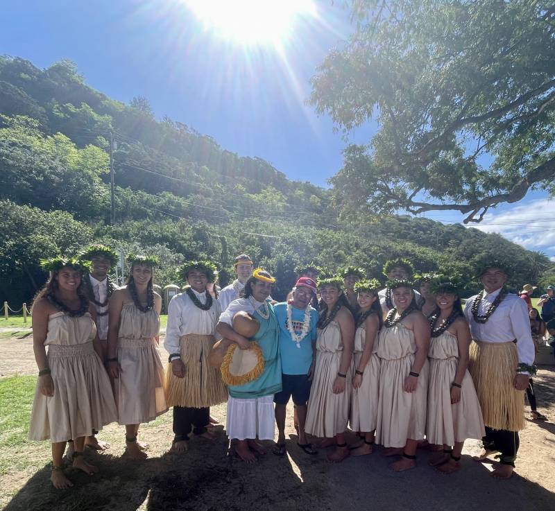 group of hula dancers pose for photo