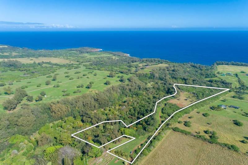 aerial view of parcel of land near ocean with with lot lines