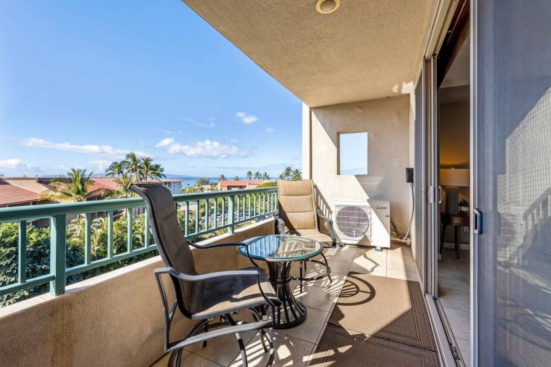 chairs and table on balcony in maui condo