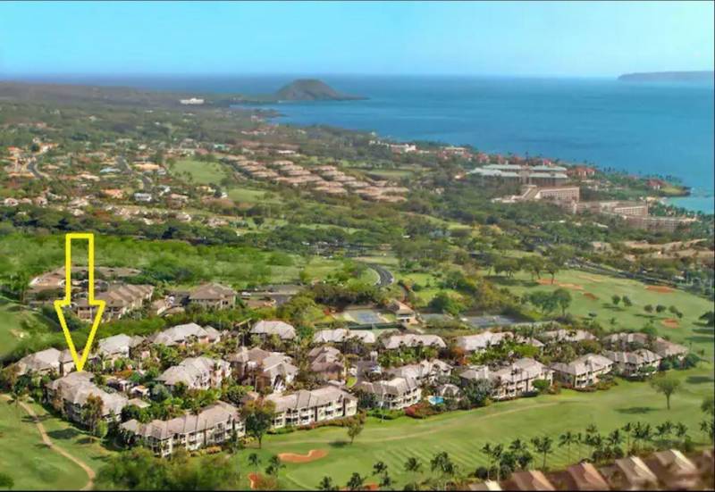 aerial view of wailea maui community with yellow arrow pointing to condo for sale
