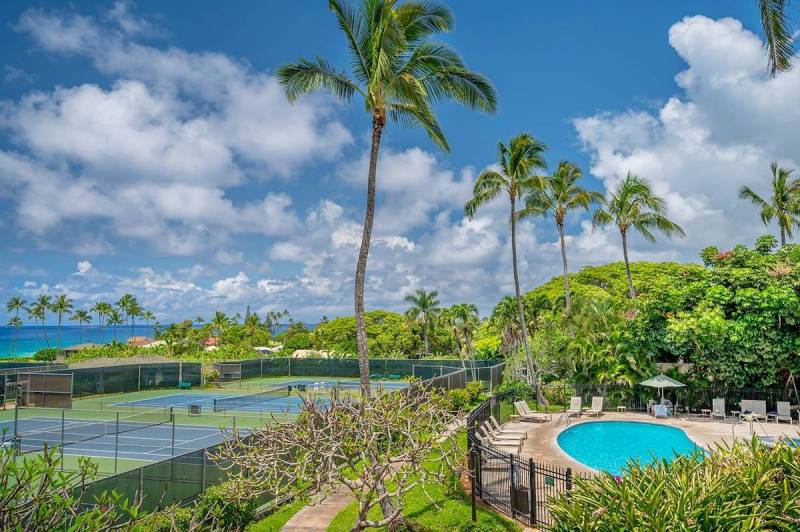 tennis courts and pool at kahala resort on kauai