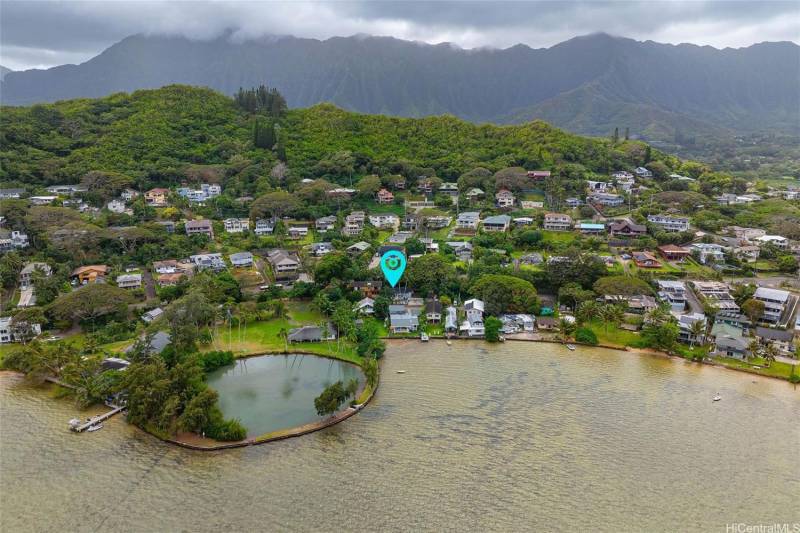 aerial view of oahu neighborhood with arrow pointing to home for sale