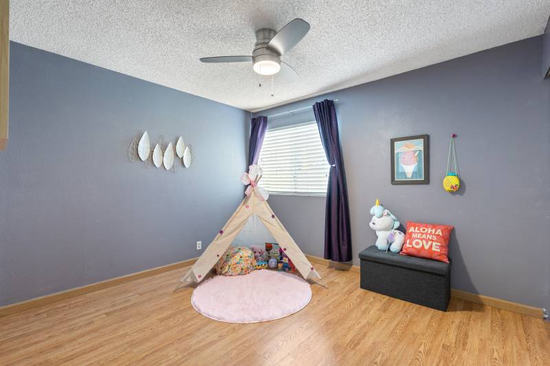 child's bedroom with small play tent