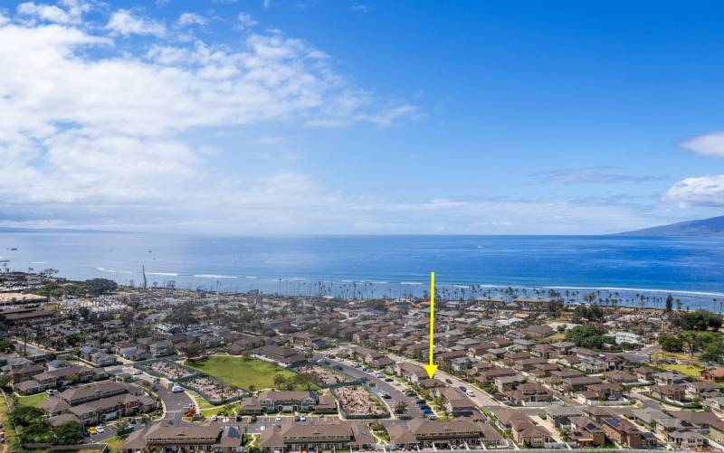 aerial view of lahaina neighborhood with yellow arrow pointing to home for sale