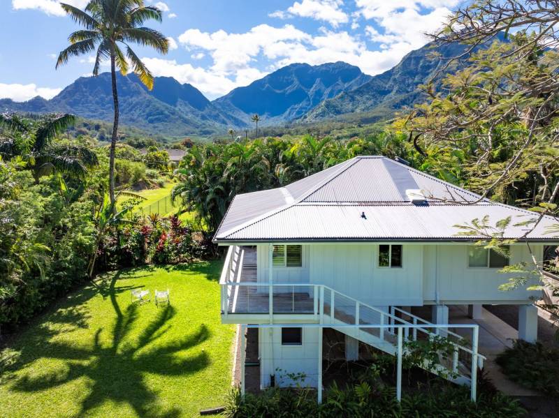 hanalei kauai home with grass backyard and mountain views