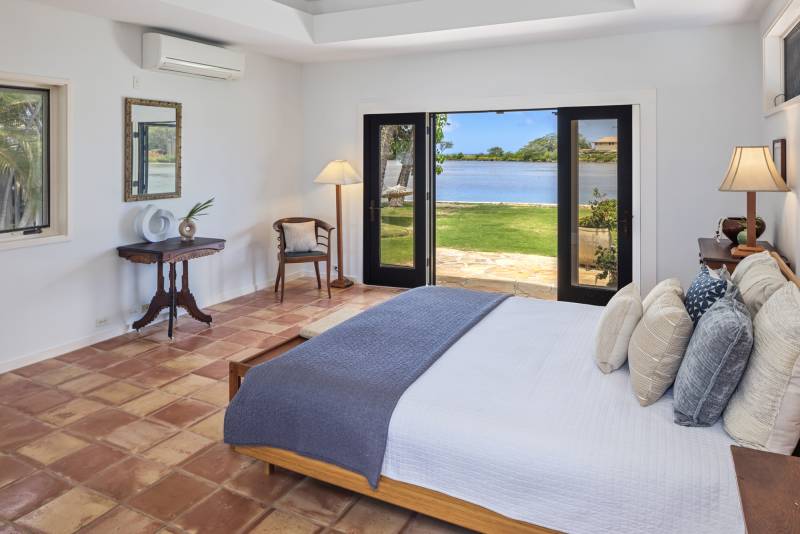 bedroom doors show view out to paiko lagoon