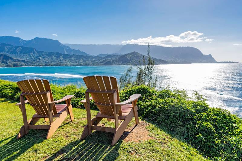 two chairs overlook ocean in princeville kauai