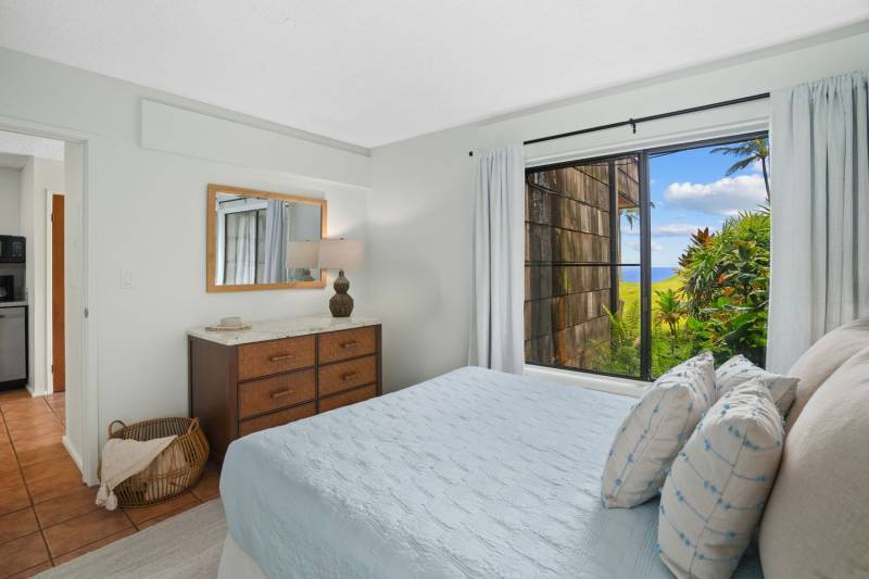 sliding glass doors in bedroom let in kauai ocean views