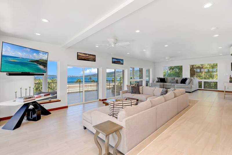 Hawaii home's living room with panoramic ocean views. 