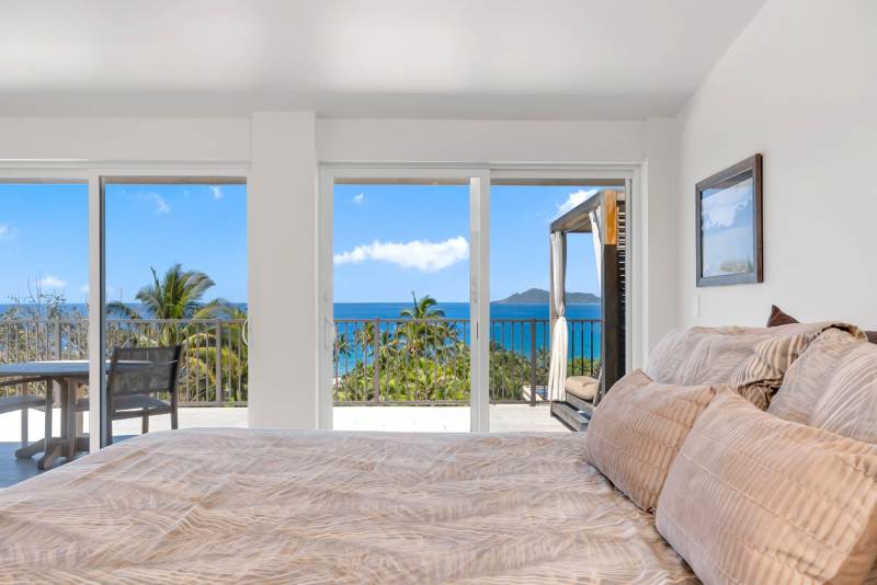 Views of ocean from primary suite at 75 Poipu Drive.