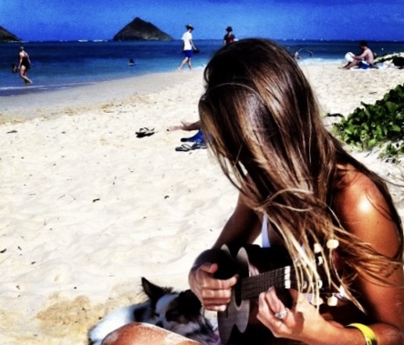 woman playing ukulele on oahu beach