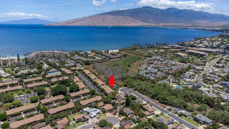 aerial drone photos of haleakala gardens condos on maui with arrow pointing to maui condo for sale